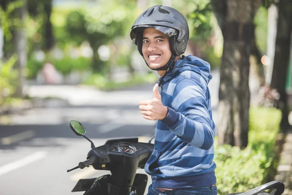 depositphotos_169491548-stock-photo-man-on-motorbike-shoving-thumb